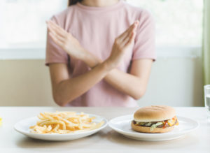 french fries and hamburger for lunh filled with saturated fat